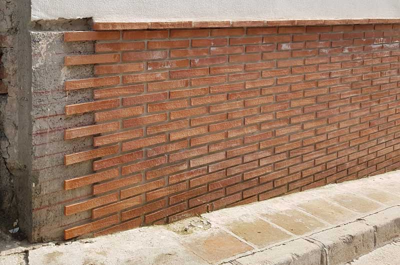 Rustic brick slips in façade